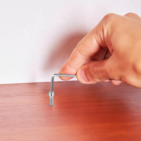 Hand using Allen key to install Beefy M3 Hex Socket Head Cap Screws With Nuts And Nut Assortment Kit In Stainless Steel on wood