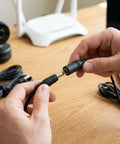 High Performance 18AWG DC Power Extension Cable 5.5mm X 2.1mm Male To Female Power Lead being connected by hands.