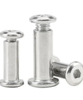 Close-up of Beefy Stainless Steel Flat Hex Socket Head Furniture Rivet Connector Insert Joint Sleeve Cap Nut, three pieces shown.