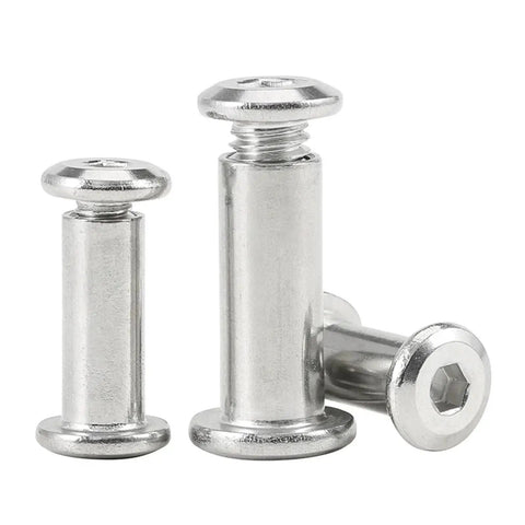 Close-up of Beefy Stainless Steel Flat Hex Socket Head Furniture Rivet Connector Insert Joint Sleeve Cap Nut, three pieces shown.
