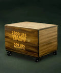 Badass Heavy Duty Polyurethane Caster Wheels With Total Locking Brake Double Ball Bearing Industrial Grade Solid Low Profile Butter Smooth Silent Roll Two Thousand Pound Capacity Pack Of Four on wooden box displaying load capacity.