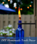 Wine Bottle Torch Kit For Outdoor Patio Lighting Wall Mount Holder With Wick Whiskey Bottle Torches Hardware Kit DIY Porch Decor Black Finish Easy Mount Refillable Flame Accent For Cozy Evenings installed on fence
