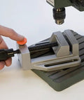Solid Aluminum Drill Press Vise With Slick Quick Release Jaws For Tabletop Rig Nine Point Five Inch Length Four Point Five Inches Wide in use.