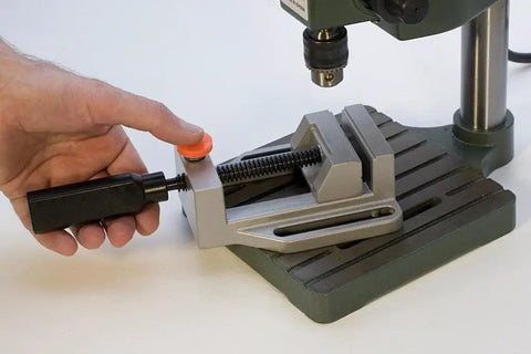 Solid Aluminum Drill Press Vise With Slick Quick Release Jaws For Tabletop Rig Nine Point Five Inch Length Four Point Five Inches Wide in use.