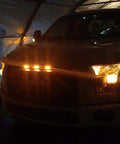 Front view of truck with Dope Three Piece LED Front Grille Marker Lights With Projector Lens Assembly and 3000K amber glow