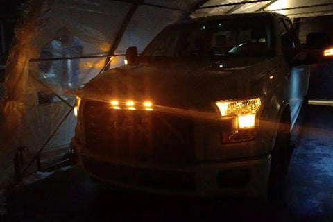 Front view of truck with Dope Three Piece LED Front Grille Marker Lights With Projector Lens Assembly and 3000K amber glow