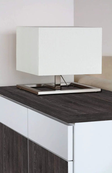 Lamp on a cabinet with Oak Schefield Dark Self Adhesive Vinyl Film 17 Inch By 78 Inch Roll Peel And Stick Decor for Cabinets.