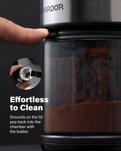 Hella Consistent Grind Flat Burr Coffee Bean Crusher With Thirty Two Precision Settings And Forty Second Auto Timer showing easy-clean feature with coffee grounds.