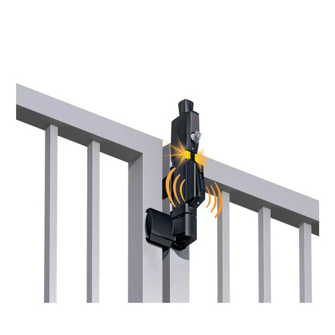 Close-up of a classic black vertical pull safety gate latch with alarm on a fence, ensuring security for kids and pets.