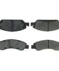Four Centric Posi Quiet ceramic brake pads with shims and hardware, front and back views.