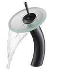 Tall Waterfall Vessel Sink Faucet In Oil Rubbed Bronze With Frosted Glass Disk Ultra Sleek Boss Look For Your Bathroom Premium Metal Build Smooth Water Flow Easy Install, side view with flowing water.