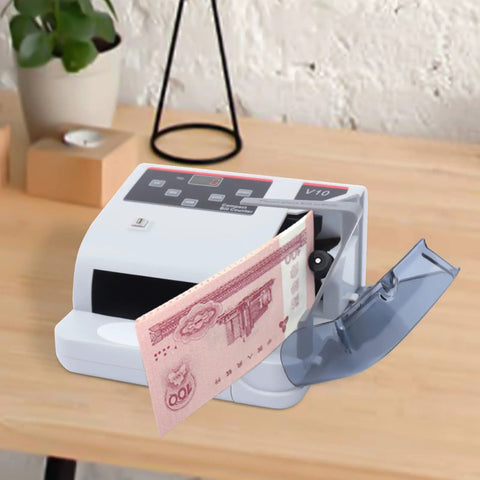 Fast Money Counter With LCD Display And Counterfeit Detection, UV MG IR Authentication on desk, counting pink bill