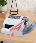Portable Money Counter Machine With LED Display And Auxiliary Bracket Hands Free Operation, Fast 600 Bills Per Minute, desk view