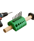 Premium Drill Guide Block For Dead On Straight Holes And Hella Accurate 45 And 90 Degree Angles with drill bits on a clamp.