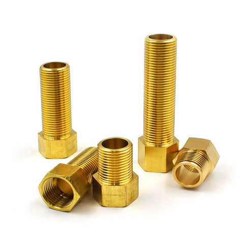Front view of brass 1/2-in extension adapters; five hex nipple fittings with male and female threads, lengths 30-100 mm