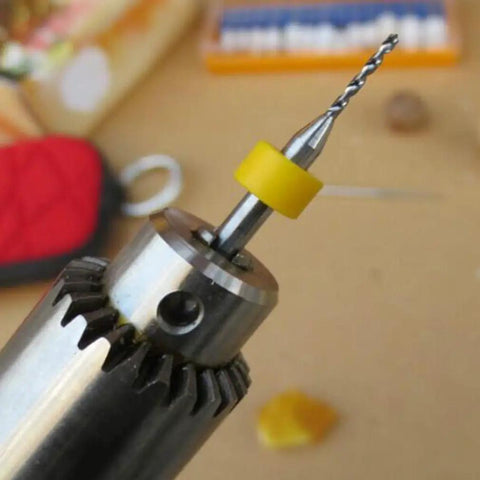 Close-up of a 10Pcs PCB Drill Bits Set Spiral Flute Carbide 0.3mm To 1.2mm with yellow collar for precision drilling