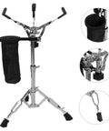 No Nonsense Height Adjustable Snare Drum Stand With Practice Pad Base features a double braced alloy tripod and drumstick holder pouch.