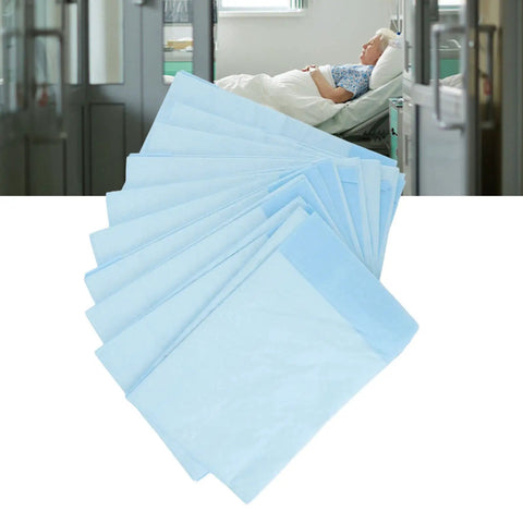 Hella Soft Disposable Bed Pads For Adults Heavy Absorbent Underpad With Odor Blocking Fluff Pulp Super Gentle On Skin Top Pick For Maternity Recovery Baby Changing And Sweet Dreams 10 Pack Large stacked and ready for use in a hospital room.