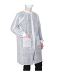 Person wearing a lab coat from Pack Of 10 Disposable Lab Coats For Adults Large With Two Pockets And Knitted Collar And Cuffs, Front Snap Closure For Quick On Off, Protective PPE For Lab Work, Cleaning, Food Processing, General Maintenance And More