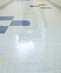 Heavy Duty Stain Resistant Floor Sealer One Gallon Clear Gloss Coating For Concrete Tile Vinyl And Rubber on shiny tiled floor.