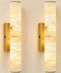Brushed Brass And Natural Alabaster Wall Sconces Set Of Two, vertical design, natural alabaster shades, warm ambient light.