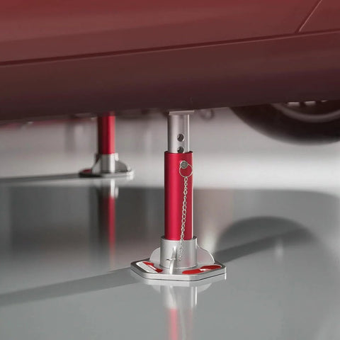 3 Ton Aluminum Jack Stands With Locking Pins supporting a vehicle for maintenance, visible under car, lightweight and portable design