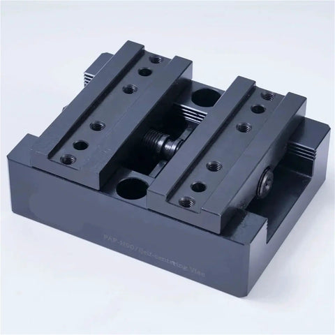 Top Shelf H90 Style Precision CNC Bench Vise With Self Centering Grips And Flexible Four Five Axis Rotation For Smoother Milling Operations and Rock Solid Workholding Performance, black metal, top view.