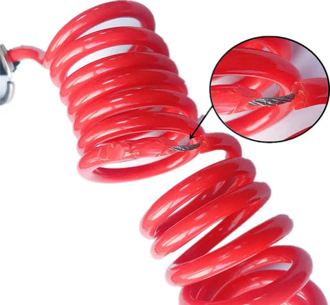 Close-up of coiled 4 Foot Breakaway Trailer Cable With Pin Emergency Brake Wire Coiled Stainless Steel Spring Beefy Heavy Duty Towing Accessory