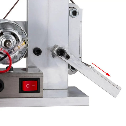 Close-up of 110V Mini Belt Sander Polisher With 9000 RPM, showing metal frame and on/off switch, partial view with edge sharpener