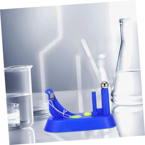 Hands On Newton Pendulum Inertia Demonstrator Kit for Classroom Physics Lab placed on a reflective surface with lab equipment