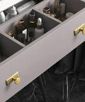 Open drawer with Antique Brass Cabinet Knob and Backplate, 1.1 Inch Diameter, showing storage compartments with various bottles.