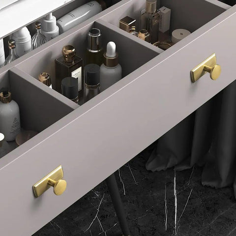 Open drawer with Antique Brass Cabinet Knob and Backplate, 1.1 Inch Diameter, showing storage compartments with various bottles.