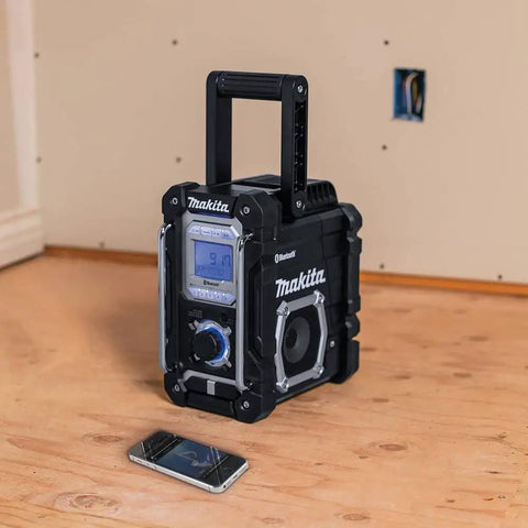 18V LXT Cordless Bluetooth Job Site Radio with FM Stereo Clock and Snooze Menu Controls on wooden surface