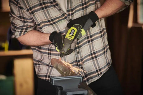 User operating Smooth Operator 12 Volt Cordless Rotary Tool Featuring Variable Speed Up To 35000 RPM, grinding metal with sparks.