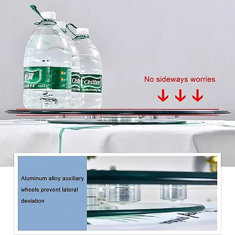 Go-To Heavy-Duty Glass Lazy Susan Turntable for Dining Tables with auxiliary wheels for stability, showing side view with water bottles