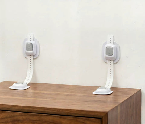 Upgraded No Drill Furniture Wall Anchors For Baby Proofing And Child Safety, 4 Pack shown on cabinet, easy setup, white