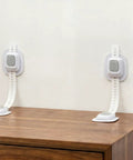 No Drill Anti Tip Furniture Straps With Heavy Duty Adhesive Wall Anchors secured to a dresser for child safety.