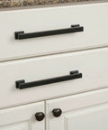 Matte black cabinet pulls on white drawers, 5-inch hole centers, part of 20 Pack Slick Matte Black Cabinet Pulls AL3061MB Durable Build