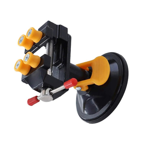 Mini Suction Vise Clamp With 360 Degree Swivel Head Grabs Tight On Smooth Desks For No Sweat Mounting with yellow rubber grips.