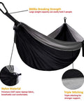 Ultra Comfortable Extra Large Double Camping Hammock With Tree Straps For Outdoor And Indoor Use Portable Gear For Two Supports Up To 500 Lbs 125 In By 79 In Hammock Bed Black And Gray, highlighting nylon material and triple stitching.