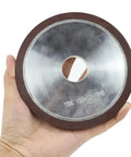 Badass 6 Inch Diamond Grinding Wheel 150 Grit Resin Bonded Flat Profile Tool For Carbide Metal And Tungsten Steel Sharpening 75 Percent Concentration Heavy Duty Workhorse Grinder, 150 grit tool held in hand.