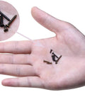 Hand holding various Top Shelf M2 Micro Screw Assortment With Cross Recessed Flat Head Tapping Fasteners in black oxide and bronze.
