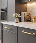 10-Pack Brushed Gold Cabinet Pulls 5-Inch Drawer Handles For Kitchen Digs Top-Shelf Zinc Alloy Hardware on grey cabinetry.