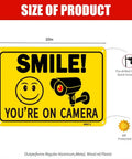 Two Pack Smile Youre On Camera Signs 10 By 7 Inch Funny Security Signs with smile face and camera icon on yellow background