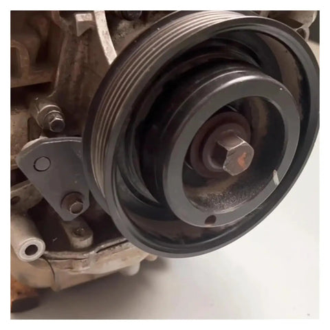 Close-up of an engine component featuring a camshaft pulley with locking tool attachment for Pro Level Camshaft Alignment Locking Timing Tool Kit For Volvo 1.5T 1.6T 2.0T 2.3T EcoBoost And Jaguar Land Rover Evoque 2.0T Heavy Duty Steel Engine Repair Set Built Tough For Shop Grade Performance.