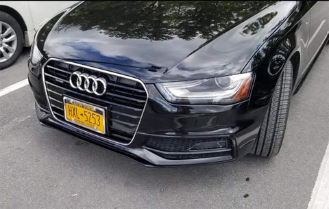 Front view of a black car with a mounted license plate, featuring a Two Pack Slim Stainless Steel License Plate Frames With Mirror Polish Finish, 4 Hole Design That Wont Block State Tags, Includes Chrome Screw Caps, Rust Resistant, Built Tough For Cars And Trucks.