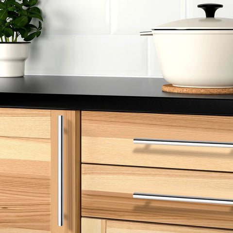 Kitchen cabinet with polished chrome T bar cabinet pulls 256mm hole centers, stainless steel handles on wood drawers and doors.