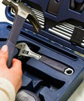 Close-up of All In One Home Tool Kit with hammer, ratchet screwdriver, Allen keys, wrench in a blue case for quick DIY fixes.