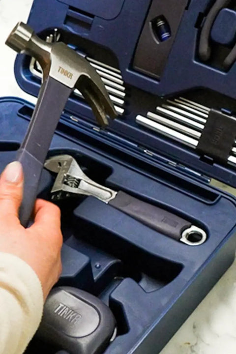 Close-up of All In One Home Tool Kit with hammer, ratchet screwdriver, Allen keys, wrench in a blue case for quick DIY fixes.