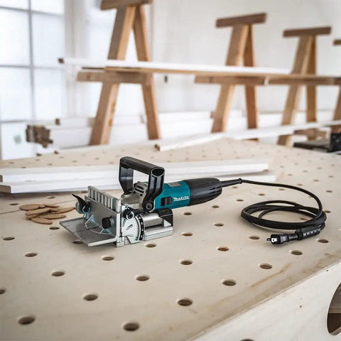 Plate Joiner For Quick, Precise Biscuit Joinery With Five Point Six Amp Motor And Eleven Thousand RPM, Cast Aluminum Pivot Fence With Zero, Forty Five, And Ninety Degree Stops, Six Depth Settings For Zero, Ten, And Twenty Biscuit Sizes on workbench